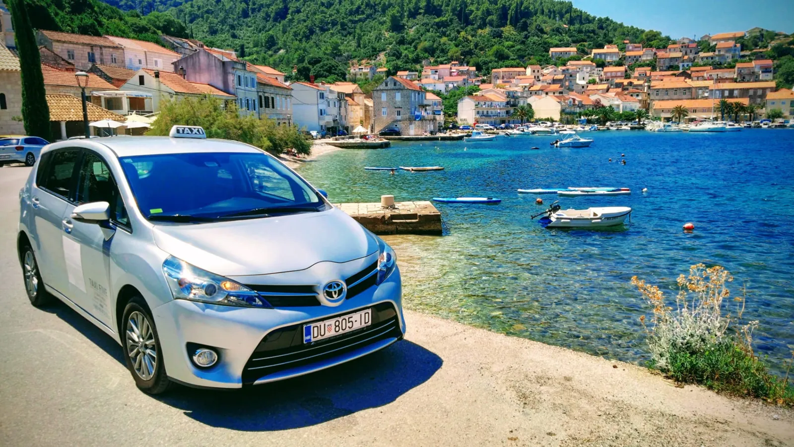 Our taxi by a turquoise bay in a village on Korčula island